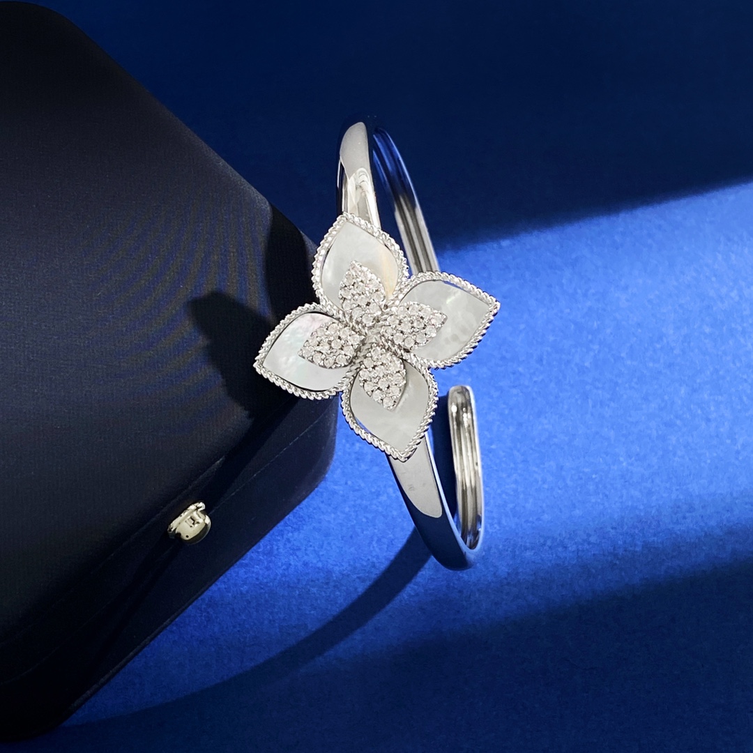 Van Cleef Arpels RC80 bracelet silver-toned metal with diamond-paved flower centers available with green malachite white mother-of-pearl black onyx turquoise blue and dark blue lapis lazuli petal inlays 17cm