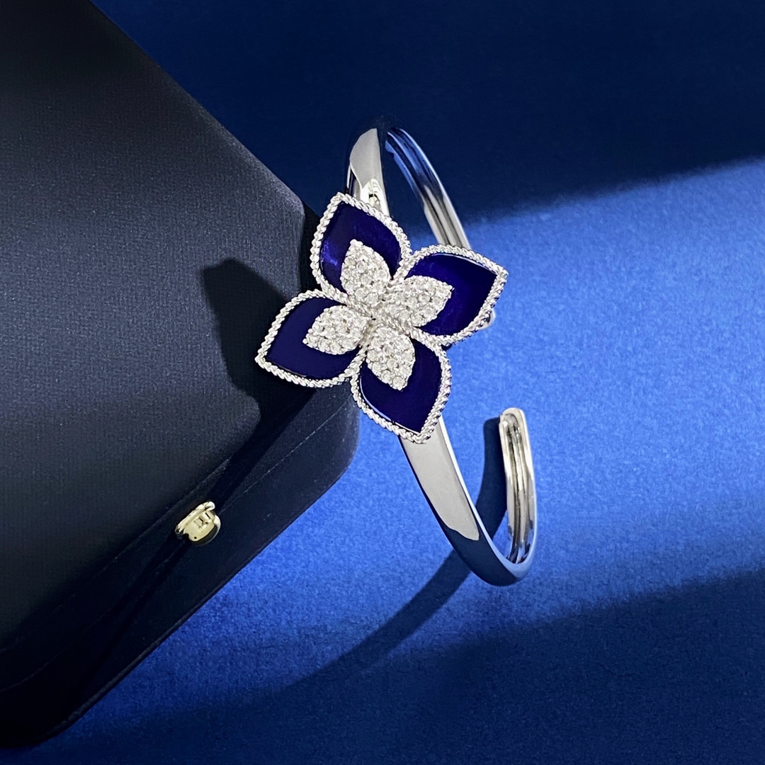 Van Cleef Arpels RC80 bracelet silver-toned metal with diamond-paved flower centers available with green malachite white mother-of-pearl black onyx turquoise blue and dark blue lapis lazuli petal inlays 17cm