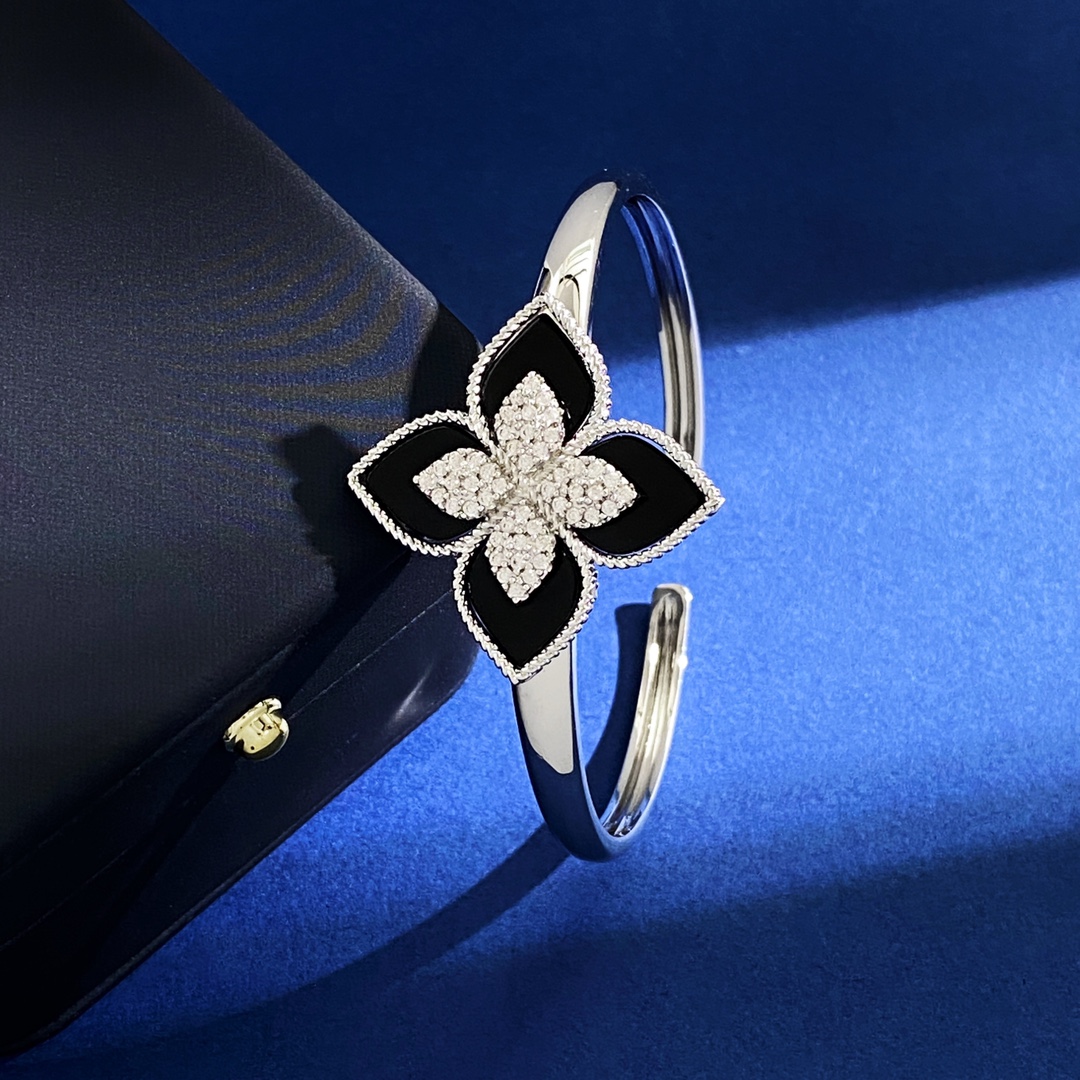 Van Cleef Arpels RC80 bracelet silver-toned metal with diamond-paved flower centers available with green malachite white mother-of-pearl black onyx turquoise blue and dark blue lapis lazuli petal inlays 17cm