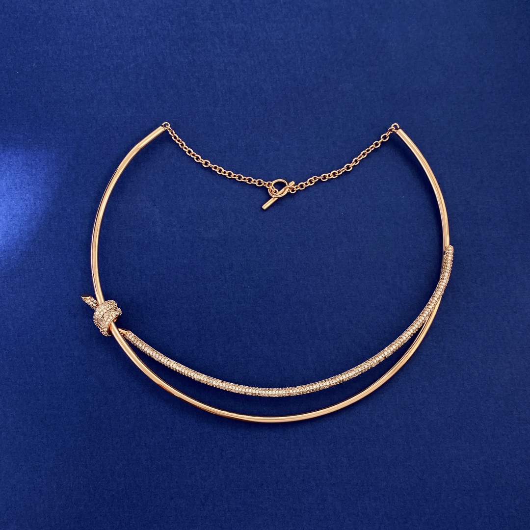 Tiffany Knot necklace silver-toned metal with clear pave stones rose gold-toned metal with clear pave stones yellow gold-toned metal with clear pave stones 16 inches with 2 inch extender