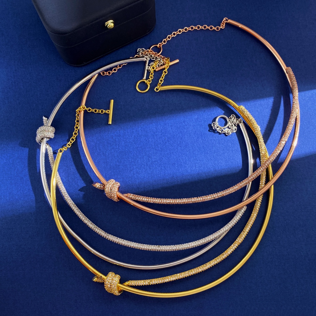 Tiffany Knot necklace silver-toned metal with clear pave stones rose gold-toned metal with clear pave stones yellow gold-toned metal with clear pave stones 16 inches with 2 inch extender
