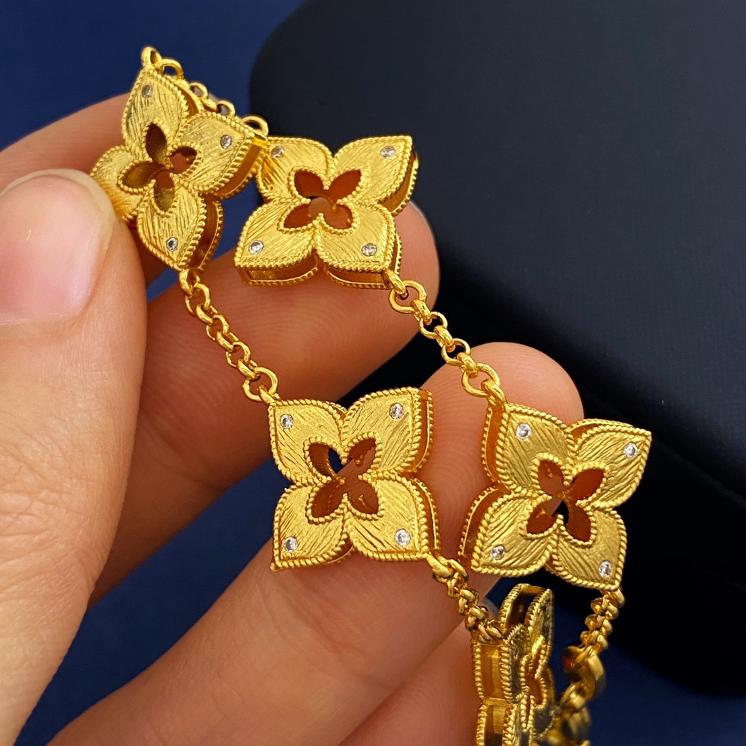 Van Cleef Arpels Venetian Flower bracelet Yellow gold with clear diamond accents and red enamel detail 18cm
