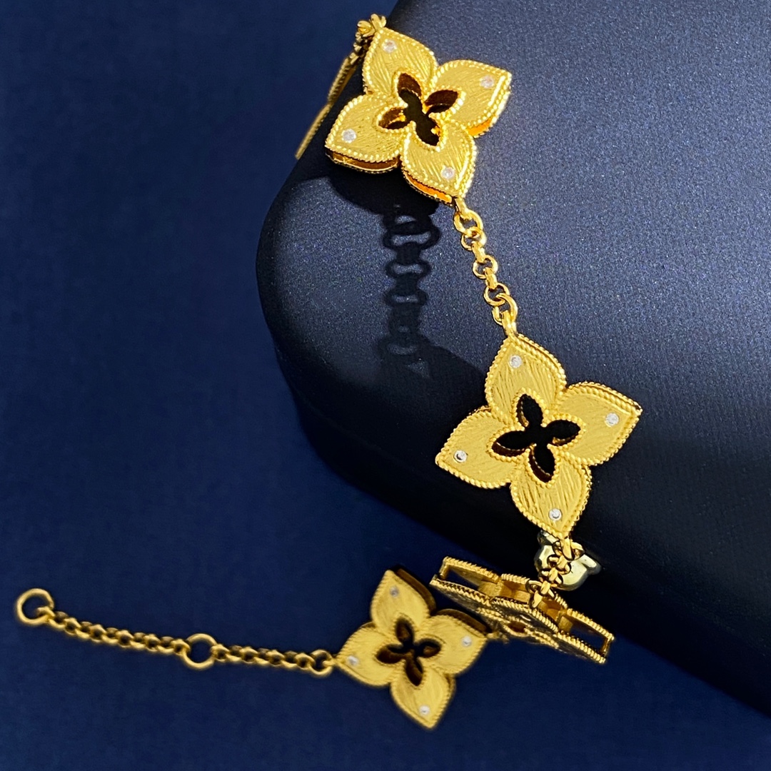 Van Cleef Arpels Venetian Flower bracelet Yellow gold with clear diamond accents and red enamel detail 18cm