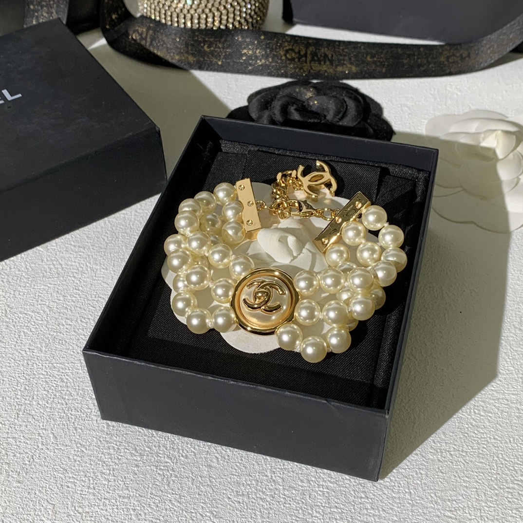 Chanel CC Turnlock Multi-Strand Pearl Bracelet bracelet Gold-tone metal cream white faux pearl 18cm