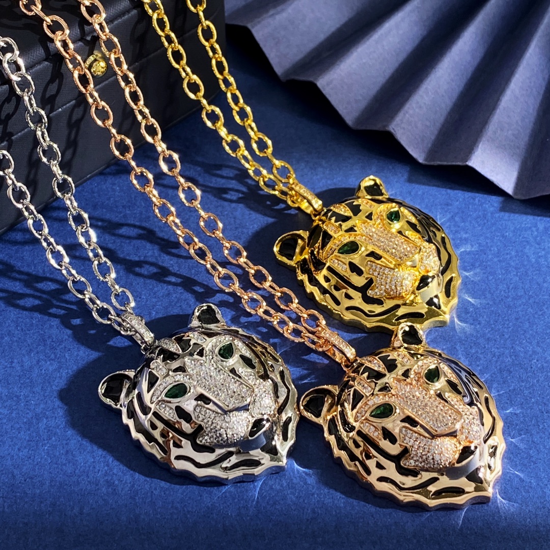 Cartier Panthere de Cartier Tiger Head Pendant necklace Yellow gold with black enamel pave-set clear diamonds and green gemstone eyes 60cm