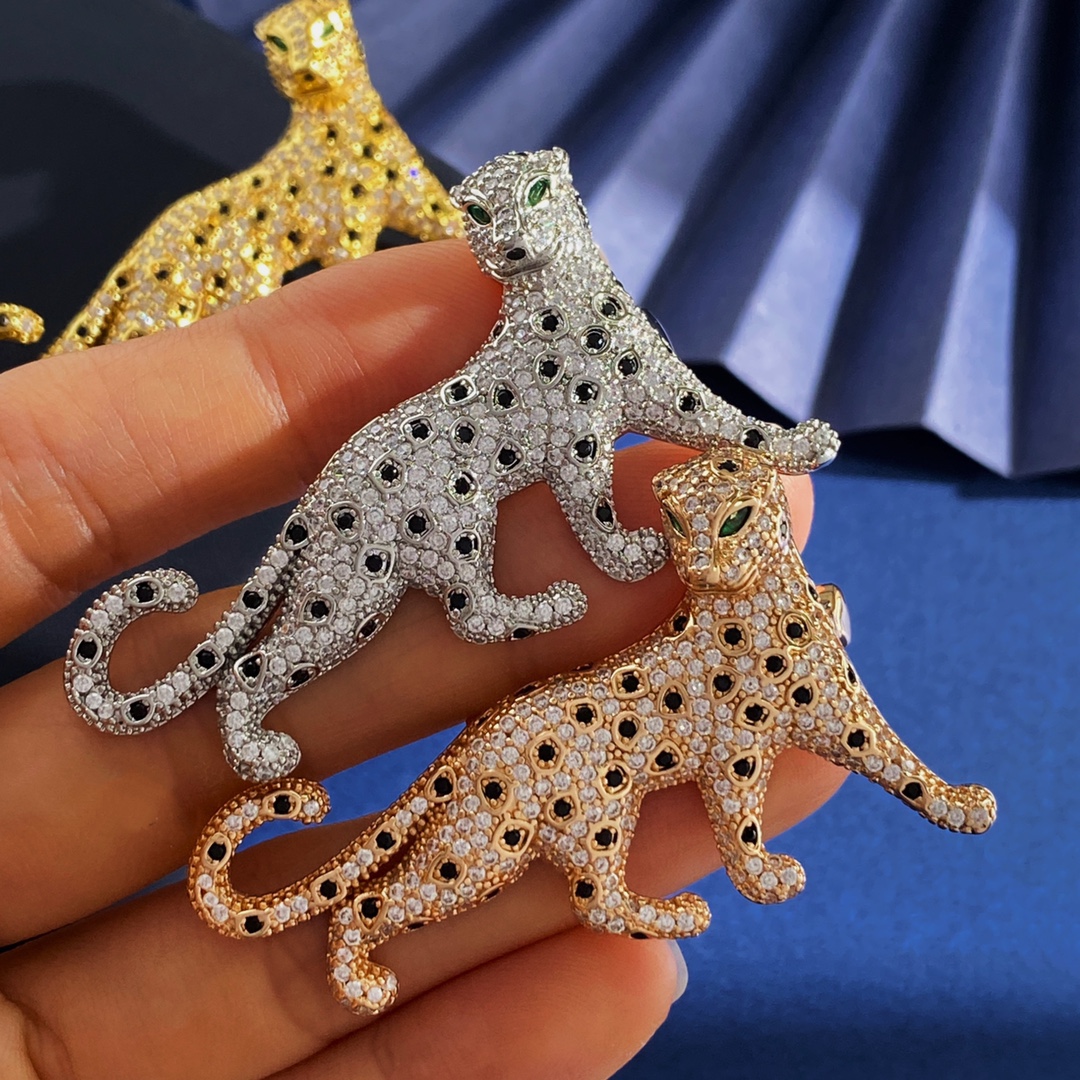 Cartier Panthere de Cartier brooch Silver-toned metal with clear pave stones black spot accents green stone eyes Gold-toned metal with clear pave stones black spot accents green stone eyes Rose gold-toned metal with clear pave stones black spot accents green stone eyes 4 5cm length