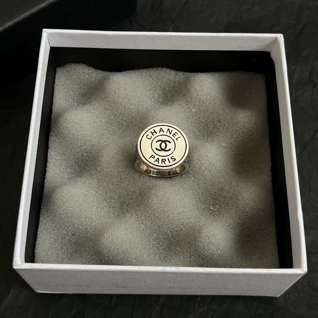 Chanel Chanel Paris CC Logo Round Signet Ring ring light gold-tone metal with cream enamel and black enamel detailing US 7