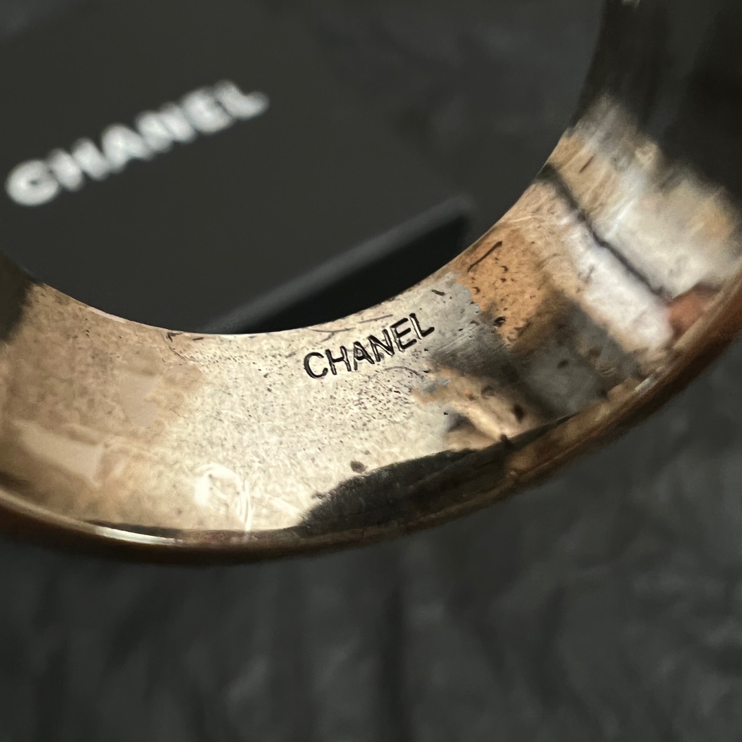 Chanel Chanel Paris CC Logo Round Signet Ring ring light gold-tone metal with cream enamel and black enamel detailing US 7