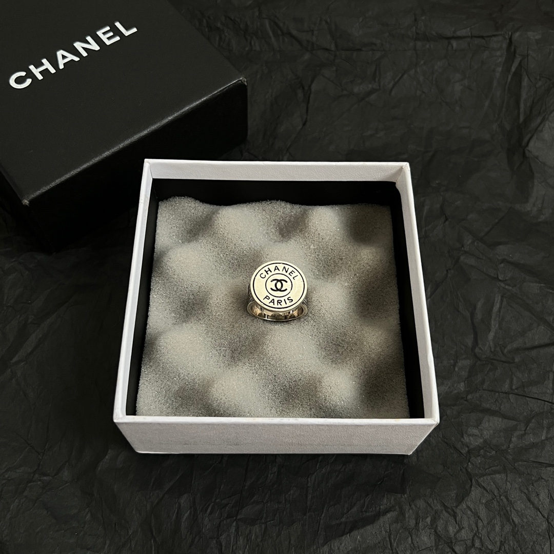 Chanel Chanel Paris CC Logo Round Signet Ring ring light gold-tone metal with cream enamel and black enamel detailing US 7