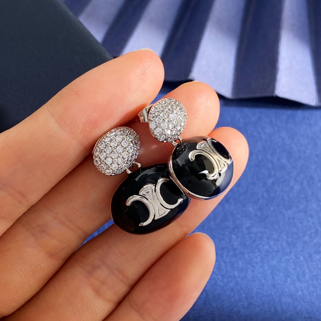 Celine Triomphe Enamel Pave Drop Earrings earrings Gold-tone metal with white enamel and clear pave crystals Silver-tone metal with white black or pink enamel and clear pave crystals One Size