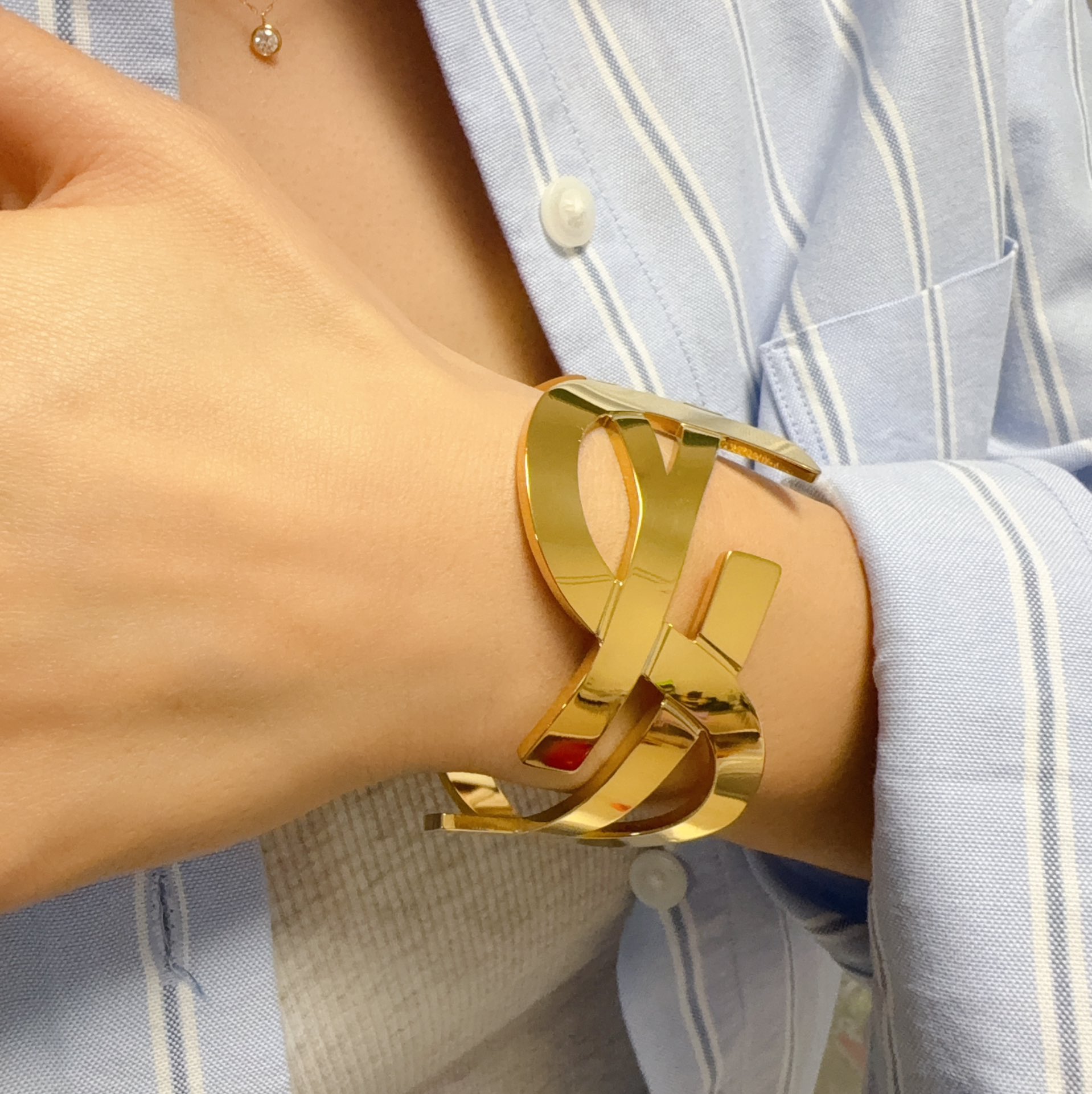 Saint Laurent Cassandre YSL Monogram Cuff bracelet Polished gold-tone metal silver-tone metal variant also available no gemstones One Size open cuff standard 6 5 inch inner circumference