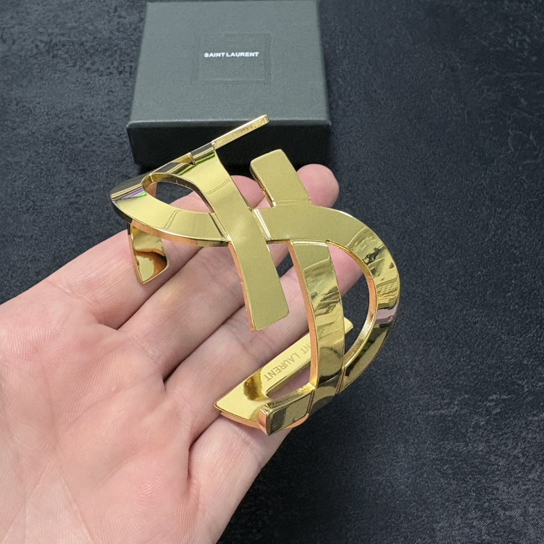 Saint Laurent Cassandre YSL Monogram Cuff bracelet Polished gold-tone metal silver-tone metal variant also available no gemstones One Size open cuff standard 6 5 inch inner circumference