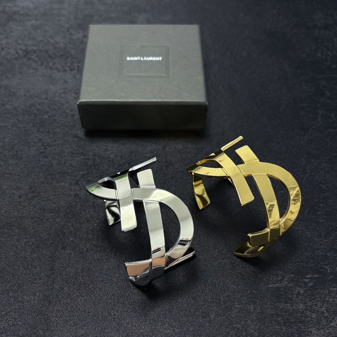 Saint Laurent Cassandre YSL Monogram Cuff bracelet Polished gold-tone metal silver-tone metal variant also available no gemstones One Size open cuff standard 6 5 inch inner circumference