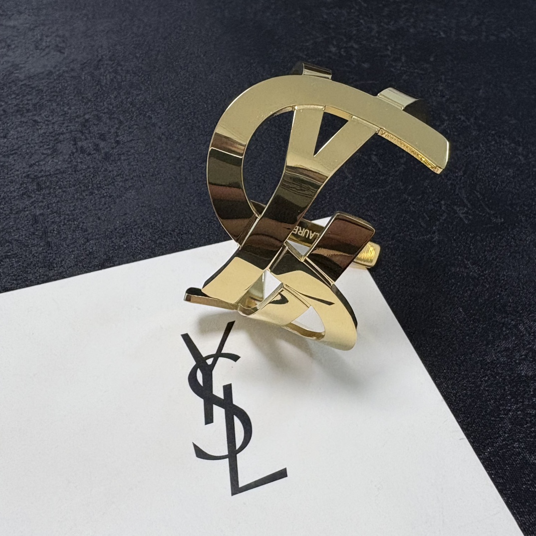 Saint Laurent Cassandre YSL Monogram Cuff bracelet Polished gold-tone metal silver-tone metal variant also available no gemstones One Size open cuff standard 6 5 inch inner circumference