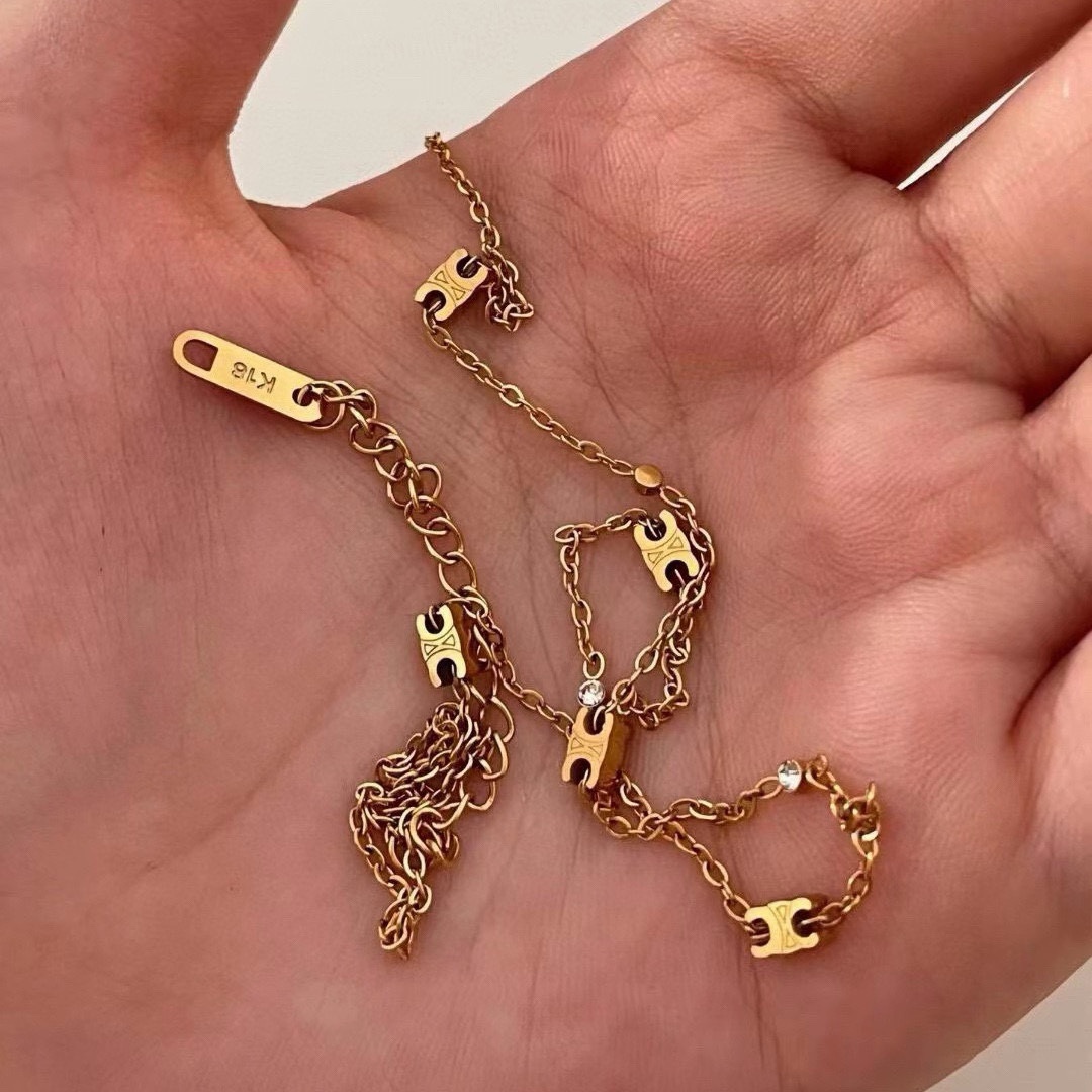 Celine Triomphe necklace gold-tone metal with clear crystal accents 40cm