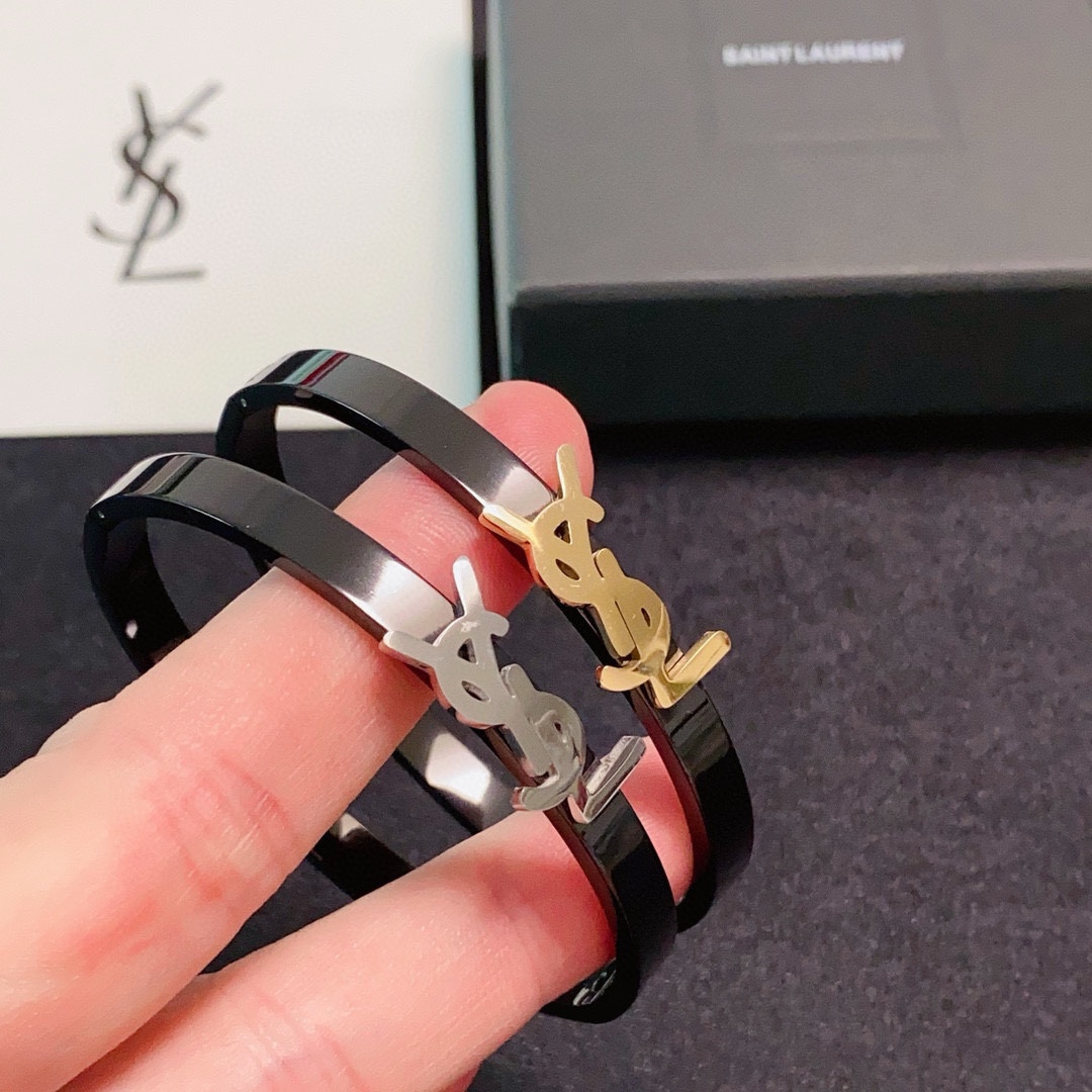 Saint Laurent Cassandre YSL Monogram Bangle bracelet black enamel with gold-tone metal logo black enamel with silver-tone metal logo 17cm inner circumference