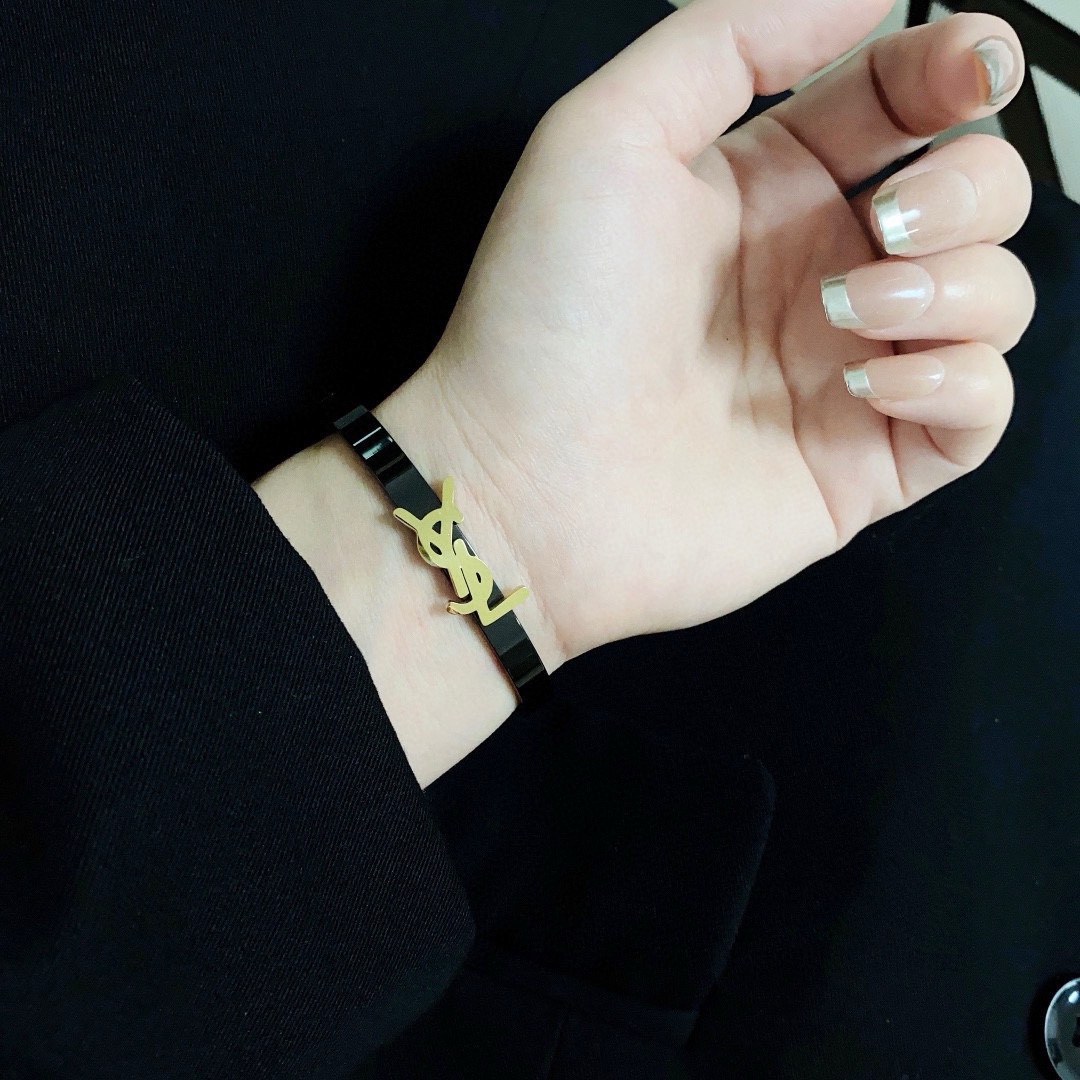 Saint Laurent Cassandre YSL Monogram Bangle bracelet black enamel with gold-tone metal logo black enamel with silver-tone metal logo 17cm inner circumference
