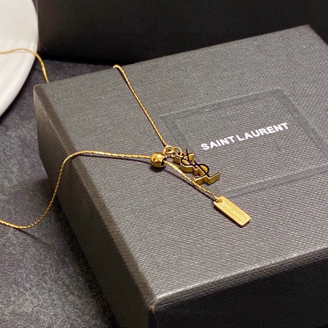 Saint Laurent Cassandre YSL Logo Lariat necklace gold-tone metal with dark-tone logo accent 45cm with 5cm extender