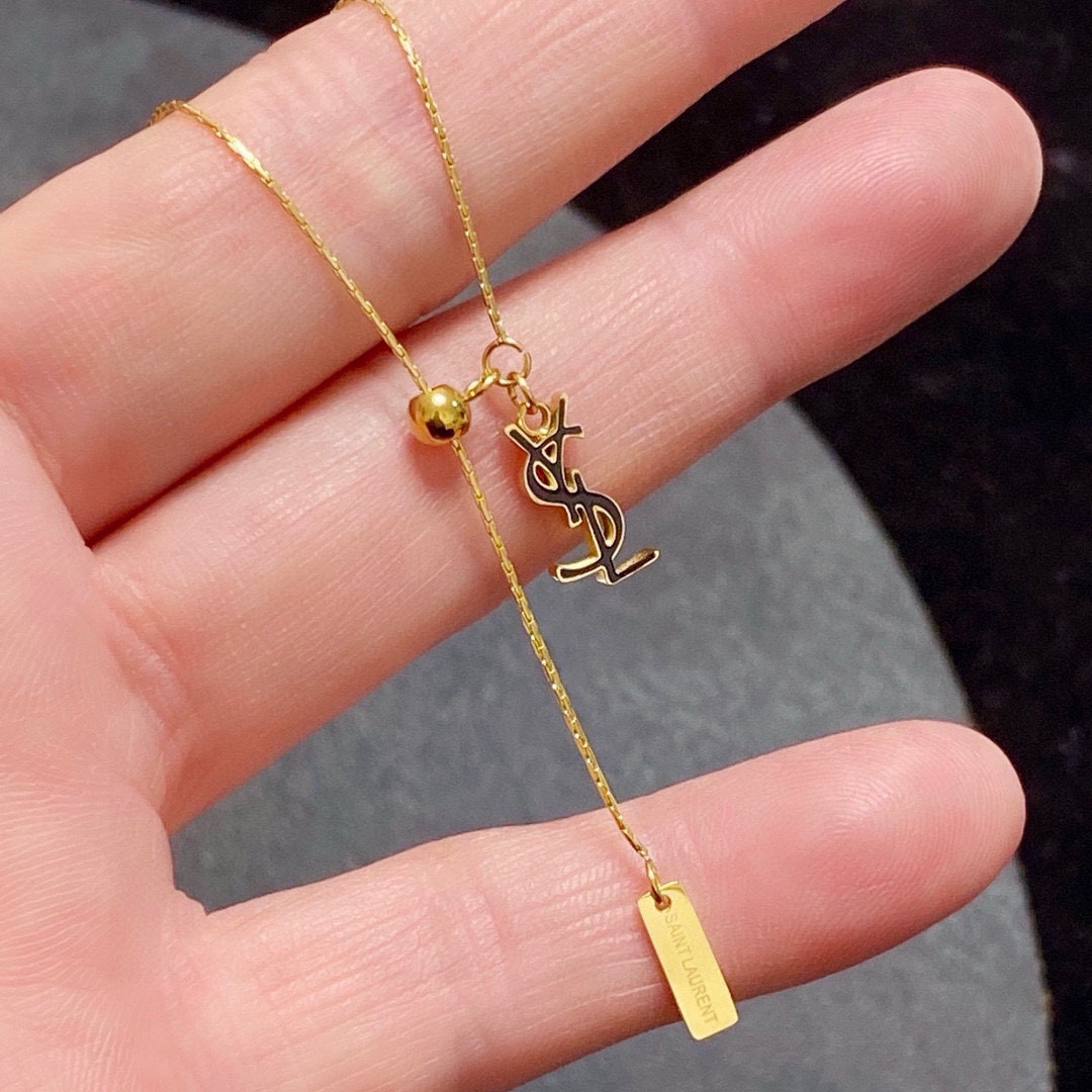 Saint Laurent Cassandre YSL Logo Lariat necklace gold-tone metal with dark-tone logo accent 45cm with 5cm extender