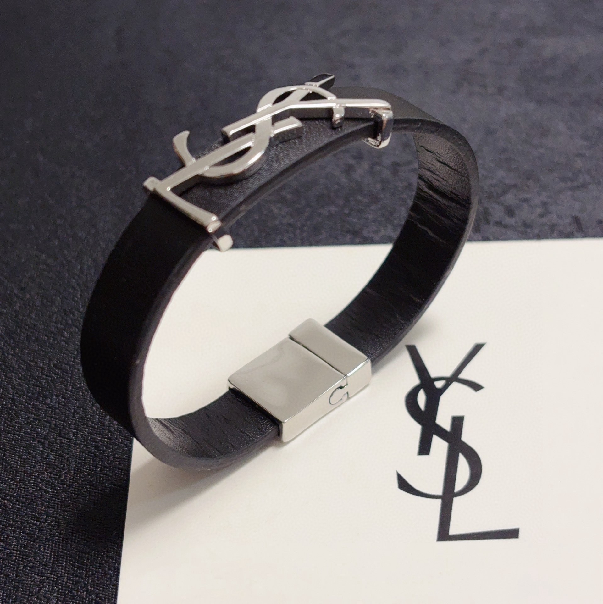 Saint Laurent Cassandre YSL Logo Leather Bracelet bracelet Black leather with silver-tone metal hardware variant with gold-tone metal hardware available 19cm