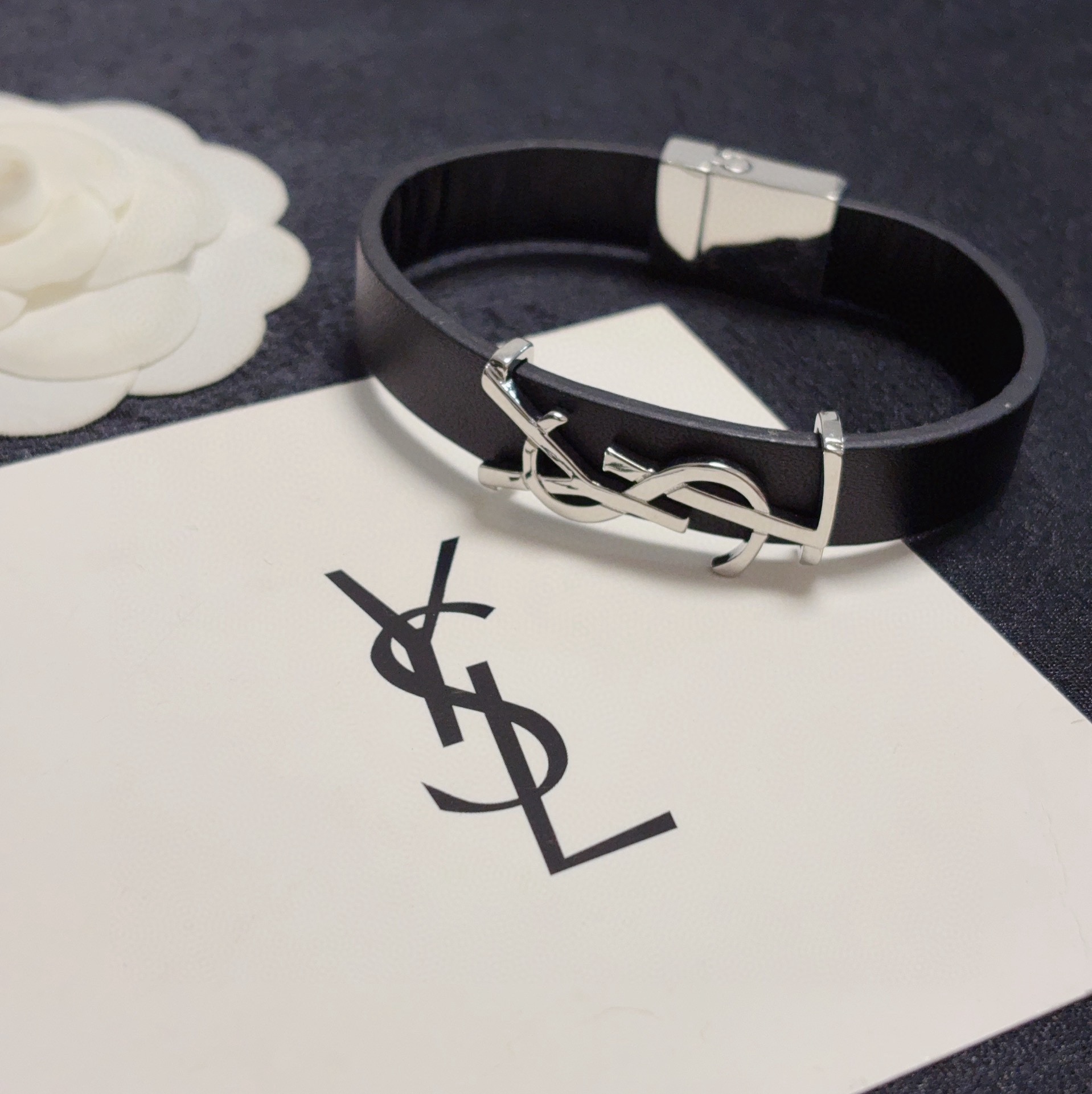 Saint Laurent Cassandre YSL Logo Leather Bracelet bracelet Black leather with silver-tone metal hardware variant with gold-tone metal hardware available 19cm