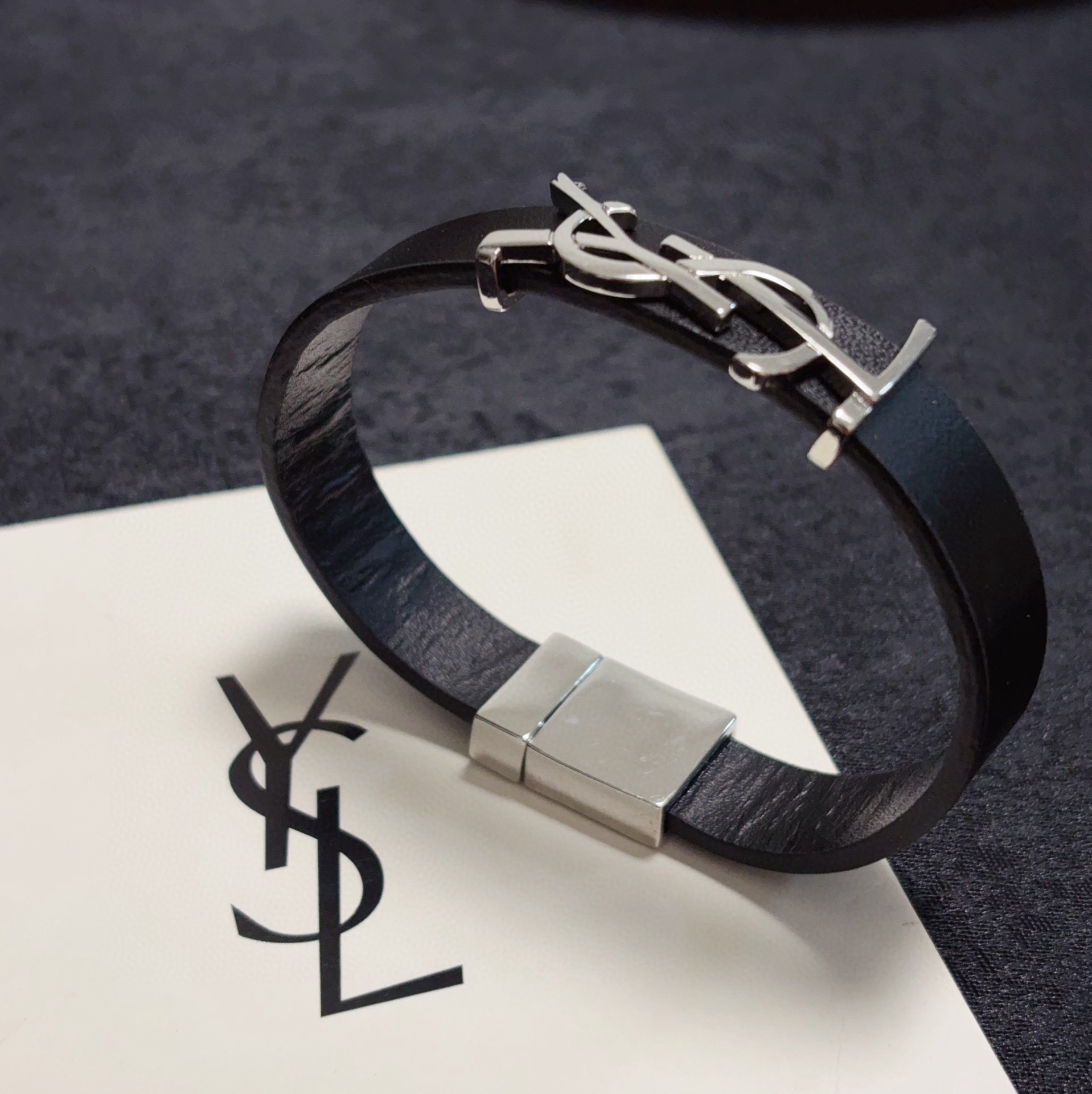 Saint Laurent Cassandre YSL Logo Leather Bracelet bracelet Black leather with silver-tone metal hardware variant with gold-tone metal hardware available 19cm