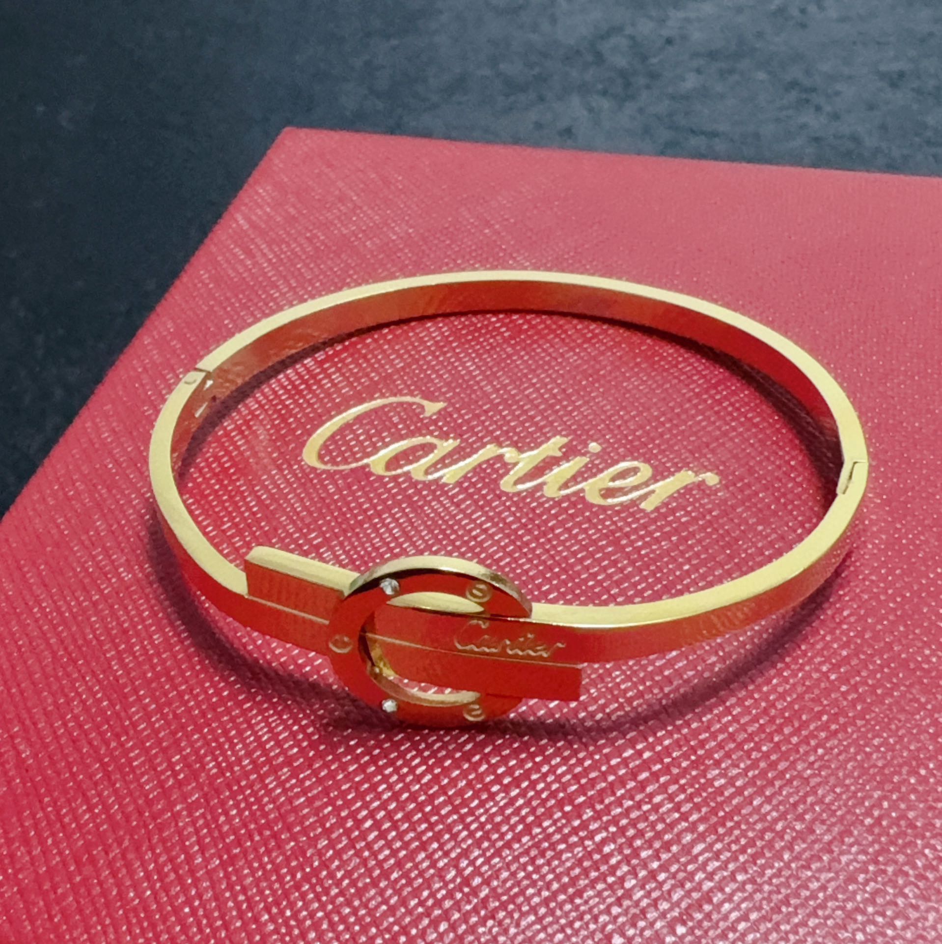 Cartier Love Signature Interlocking Bangle bracelet 18k yellow gold with clear diamond accents 17cm