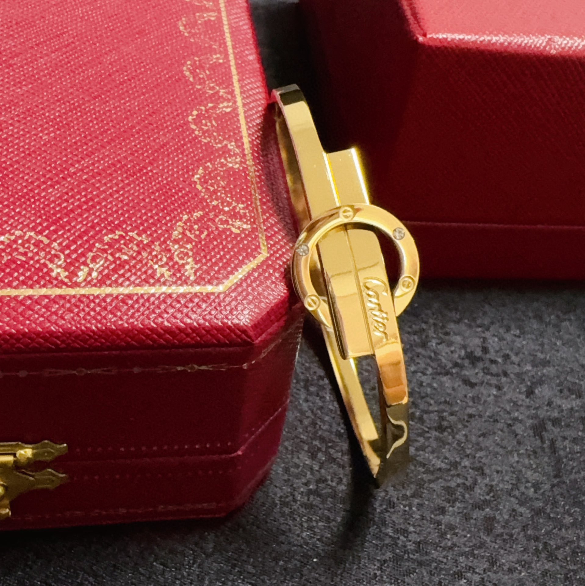 Cartier Love Signature Interlocking Bangle bracelet 18k yellow gold with clear diamond accents 17cm