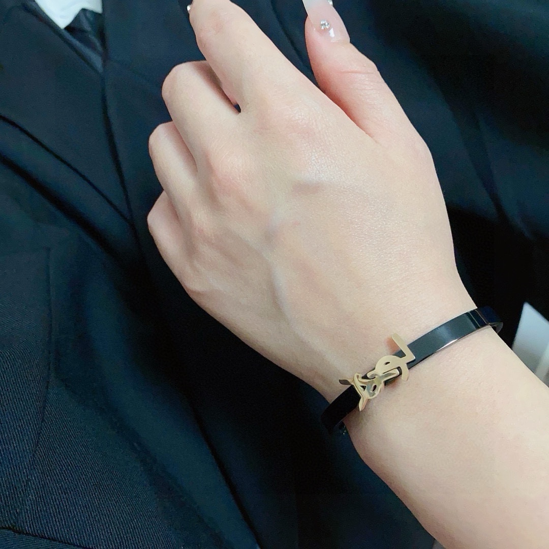 Saint Laurent Cassandre YSL Monogram bracelet black enamel band with gold-tone metal logo 17cm inner circumference