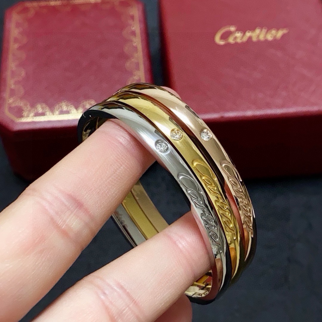 Cartier C de Cartier Signature Bangle bracelet 18k white gold 18k yellow gold 18k rose gold clear diamond accents 17