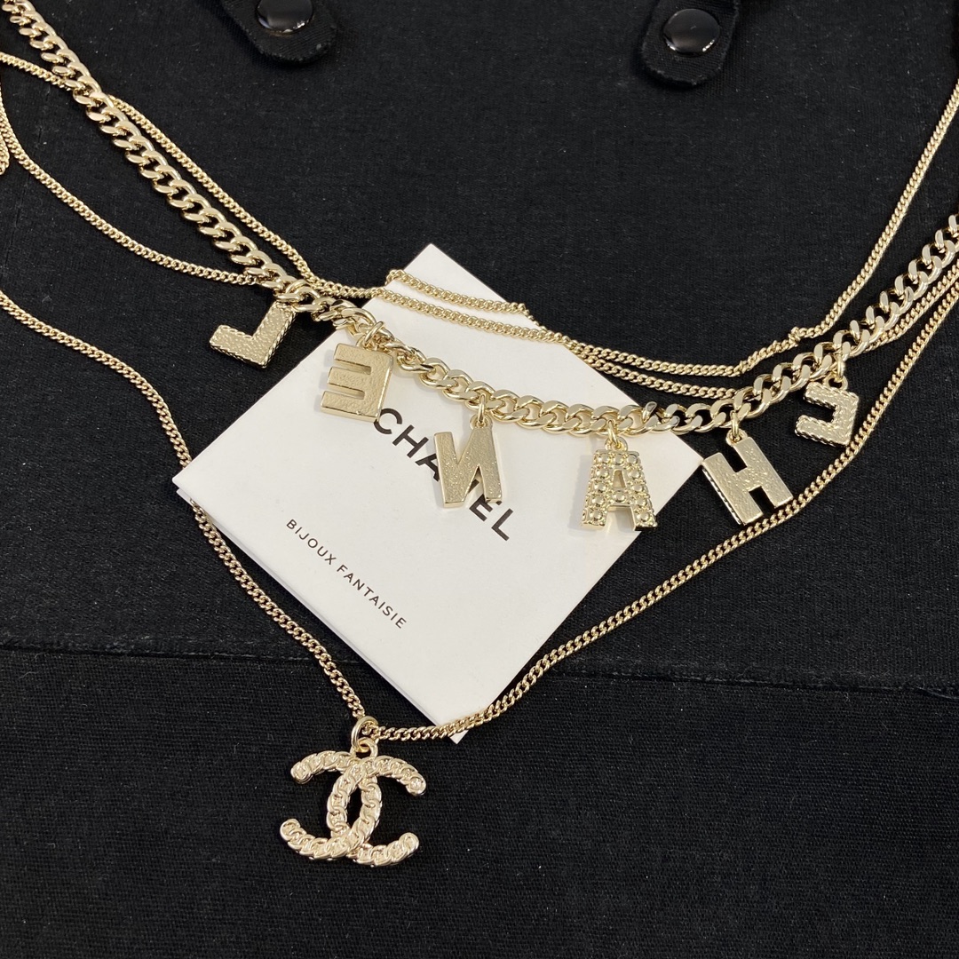 Chanel CHANEL Letter CC Logo Layered Necklace necklace Gold-tone metal with white pink yellow red enamel white faux pearls light blue crystal accents 42cm
