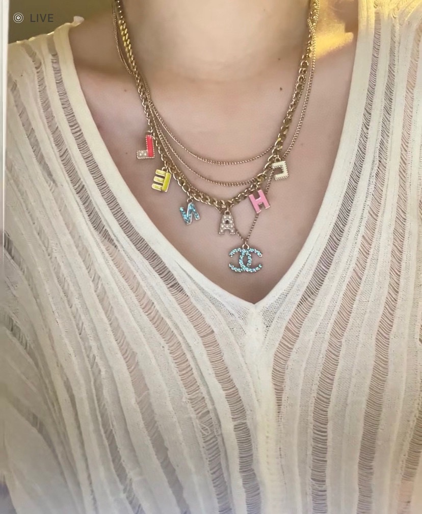 Chanel CHANEL Letter CC Logo Layered Necklace necklace Gold-tone metal with white pink yellow red enamel white faux pearls light blue crystal accents 42cm