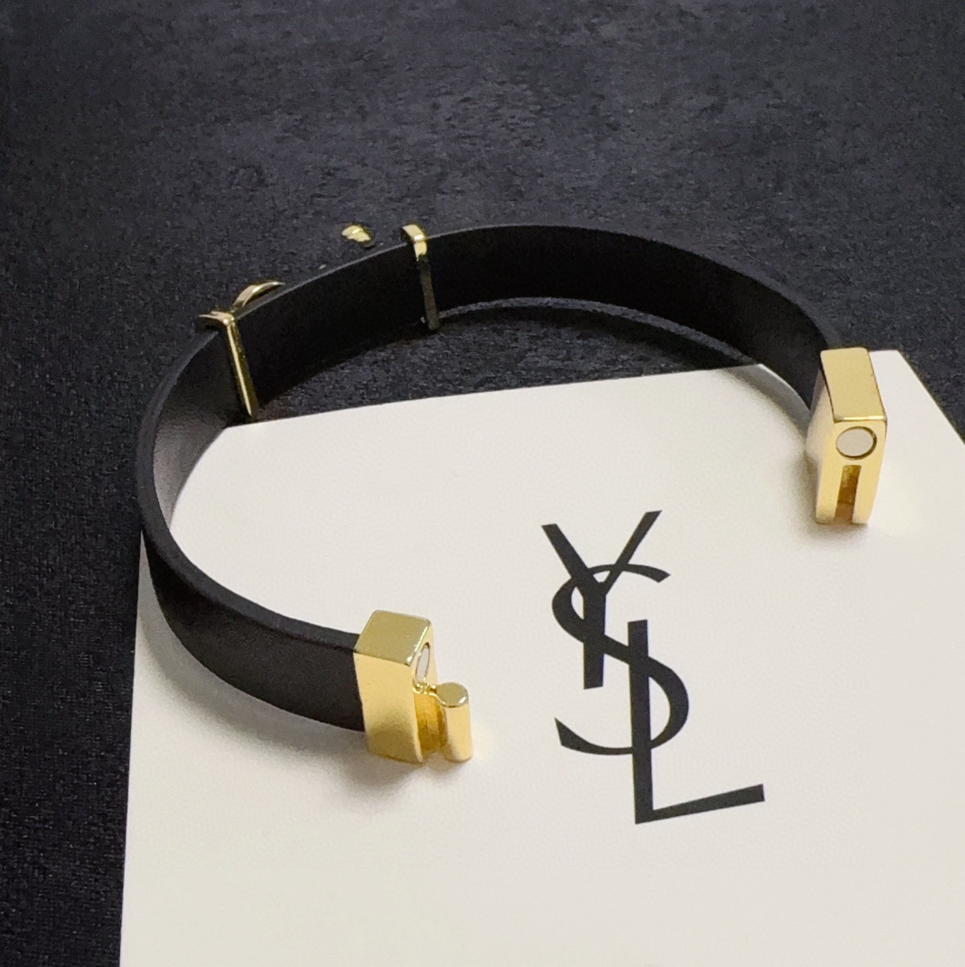Saint Laurent Cassandre bracelet black leather gold-tone metal 17cm