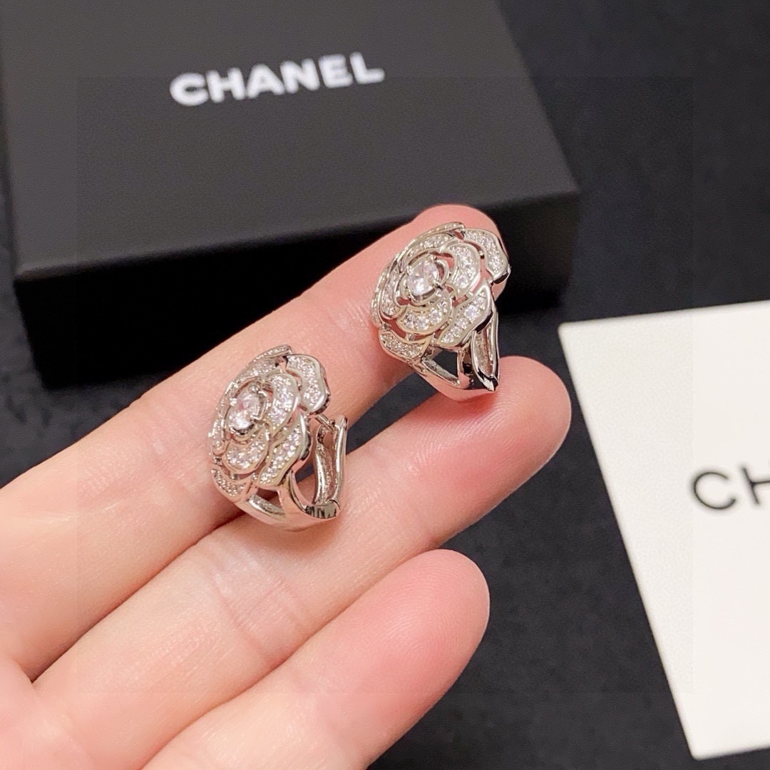 Chanel Camelia earrings silver-toned metal with clear diamond-like stones 1 5cm diameter