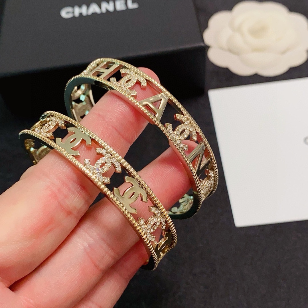 Chanel CC Logo Crystal Cutout Cuff bracelet gold-tone metal with clear crystal accents 17cm inner circumference