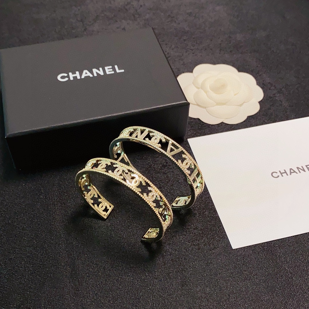 Chanel CC Logo Crystal Cutout Cuff bracelet gold-tone metal with clear crystal accents 17cm inner circumference
