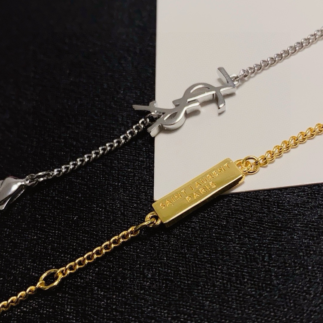 Saint Laurent Cassandre Heart Charm bracelet gold-tone metal with clear cubic zirconia accent 16cm with 3cm extender