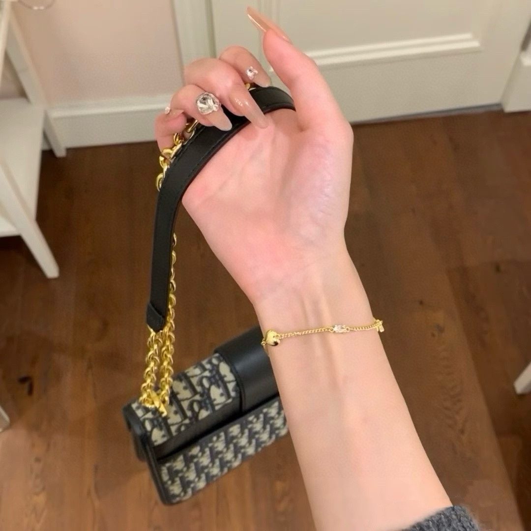 Saint Laurent Cassandre Heart Charm bracelet gold-tone metal with clear cubic zirconia accent 16cm with 3cm extender