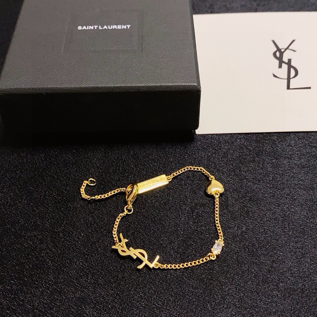 Saint Laurent Cassandre Heart Charm bracelet gold-tone metal with clear cubic zirconia accent 16cm with 3cm extender