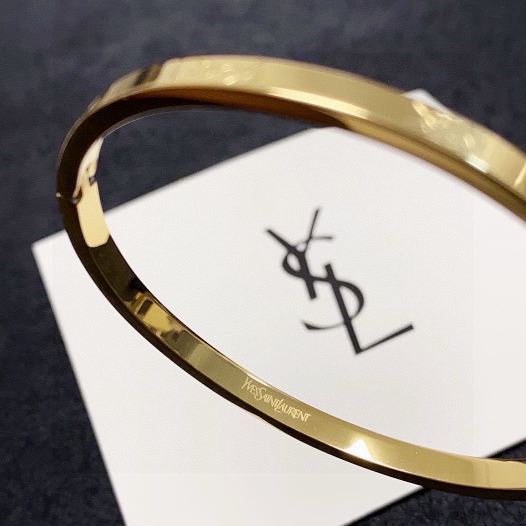 Saint Laurent Cassandre Logo Engraved Bangle bracelet gold-tone metal no accent stones 17cm inner circumference
