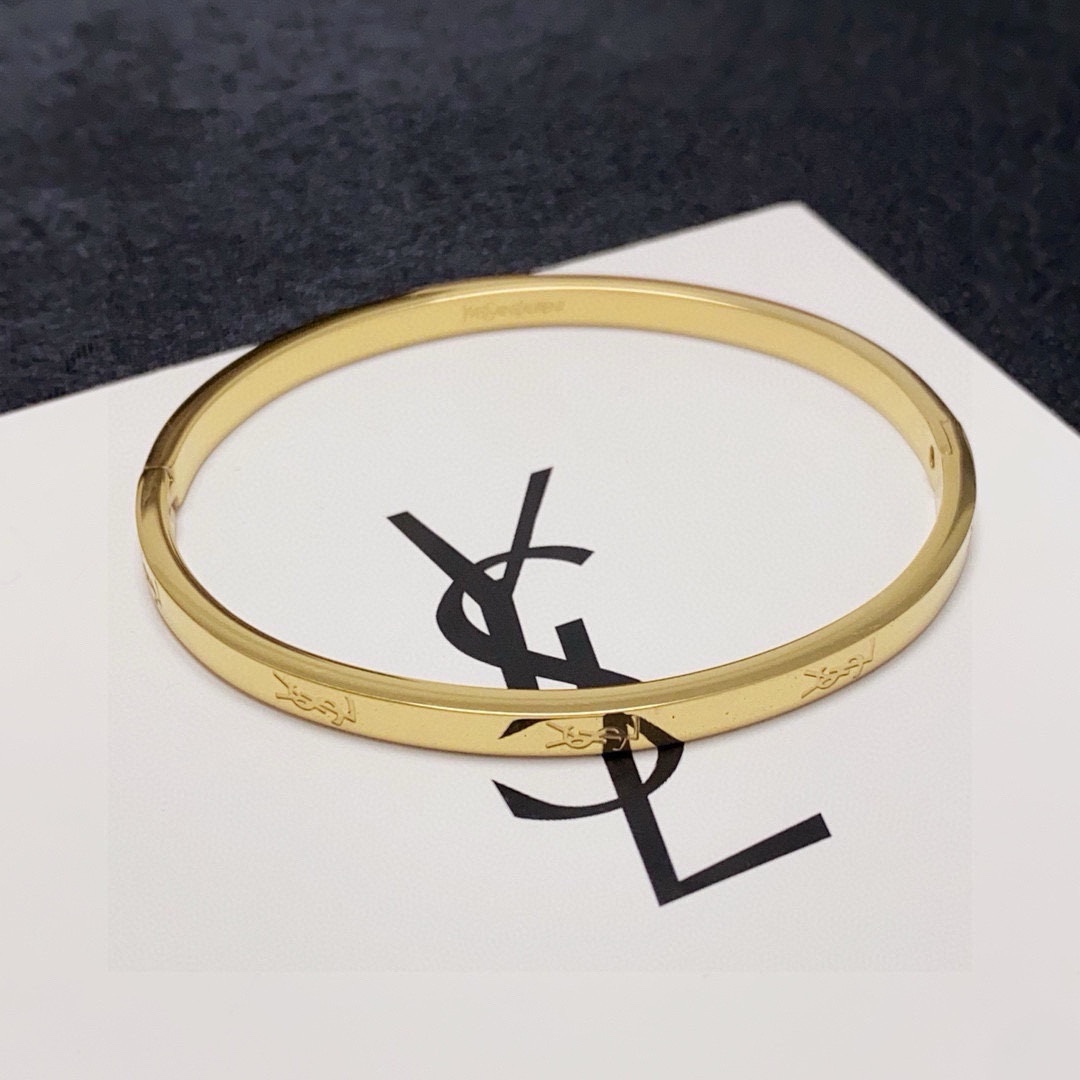 Saint Laurent Cassandre Logo Engraved Bangle bracelet gold-tone metal no accent stones 17cm inner circumference