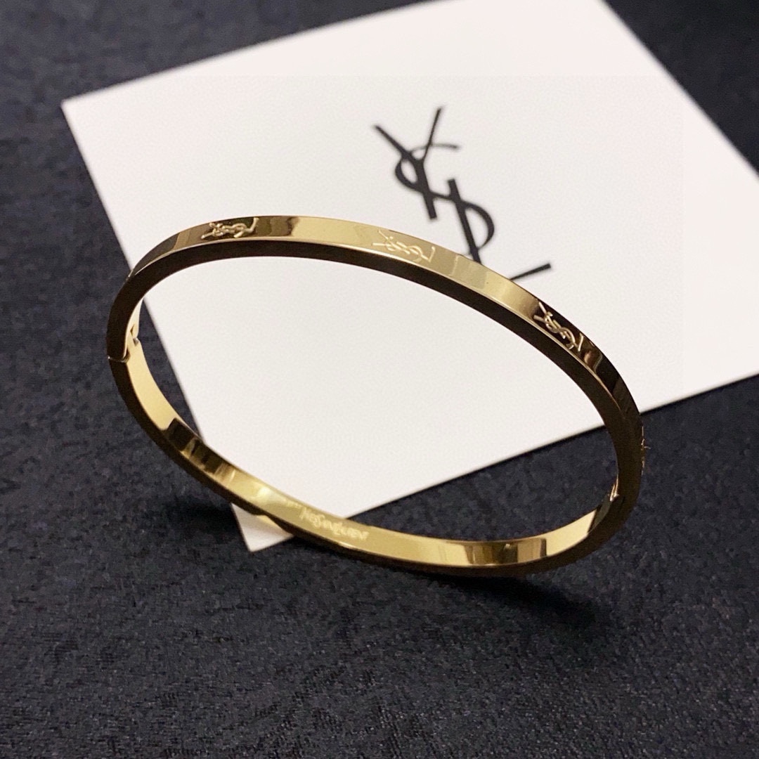 Saint Laurent Cassandre Logo Engraved Bangle bracelet gold-tone metal no accent stones 17cm inner circumference