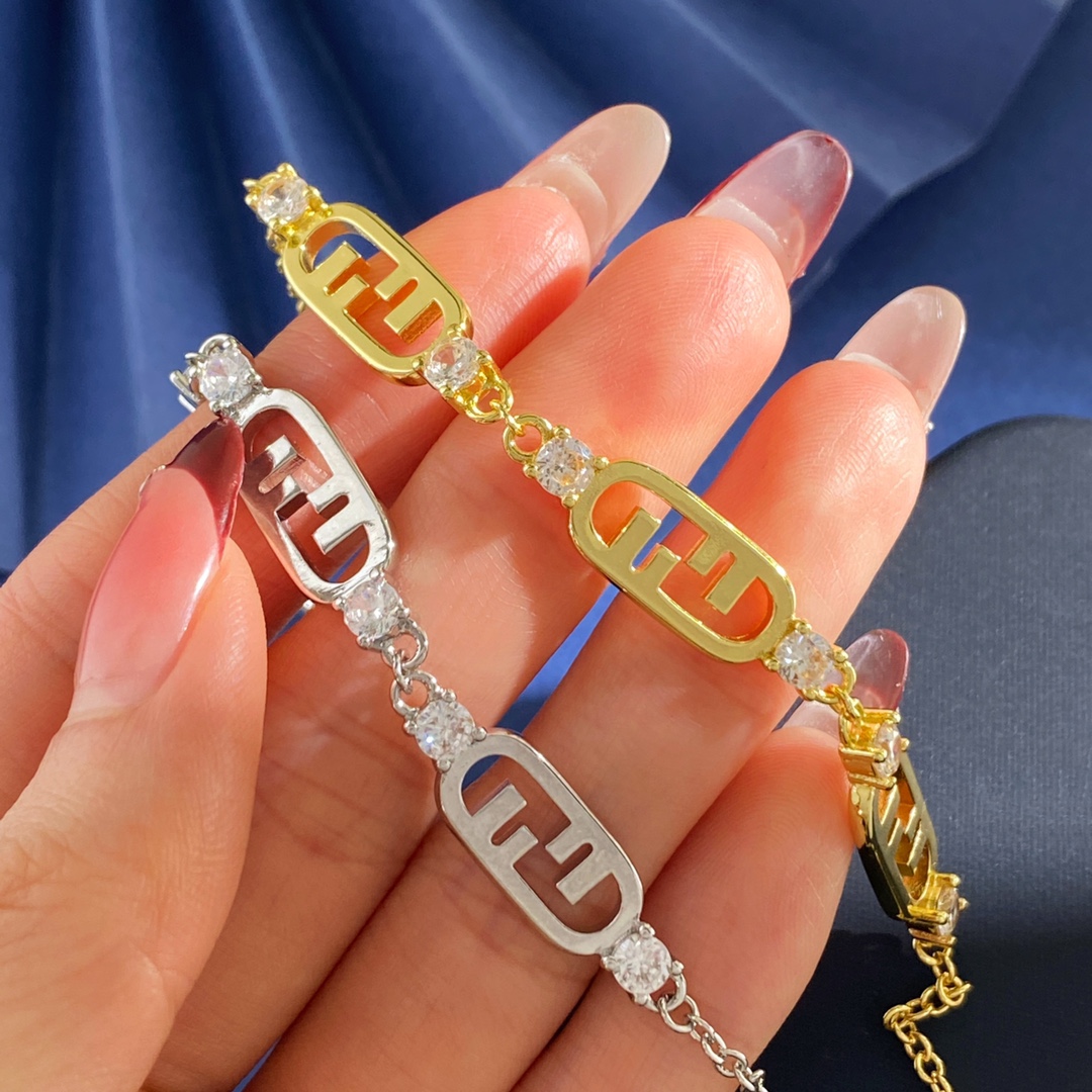 Fendi O Lock bracelet Gold-tone metal with clear faceted stones also available in silver-tone metal with clear faceted stones Adjustable with extension chain fits 16-19cm wrist
