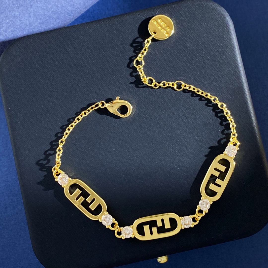 Fendi O Lock bracelet Gold-tone metal with clear faceted stones also available in silver-tone metal with clear faceted stones Adjustable with extension chain fits 16-19cm wrist