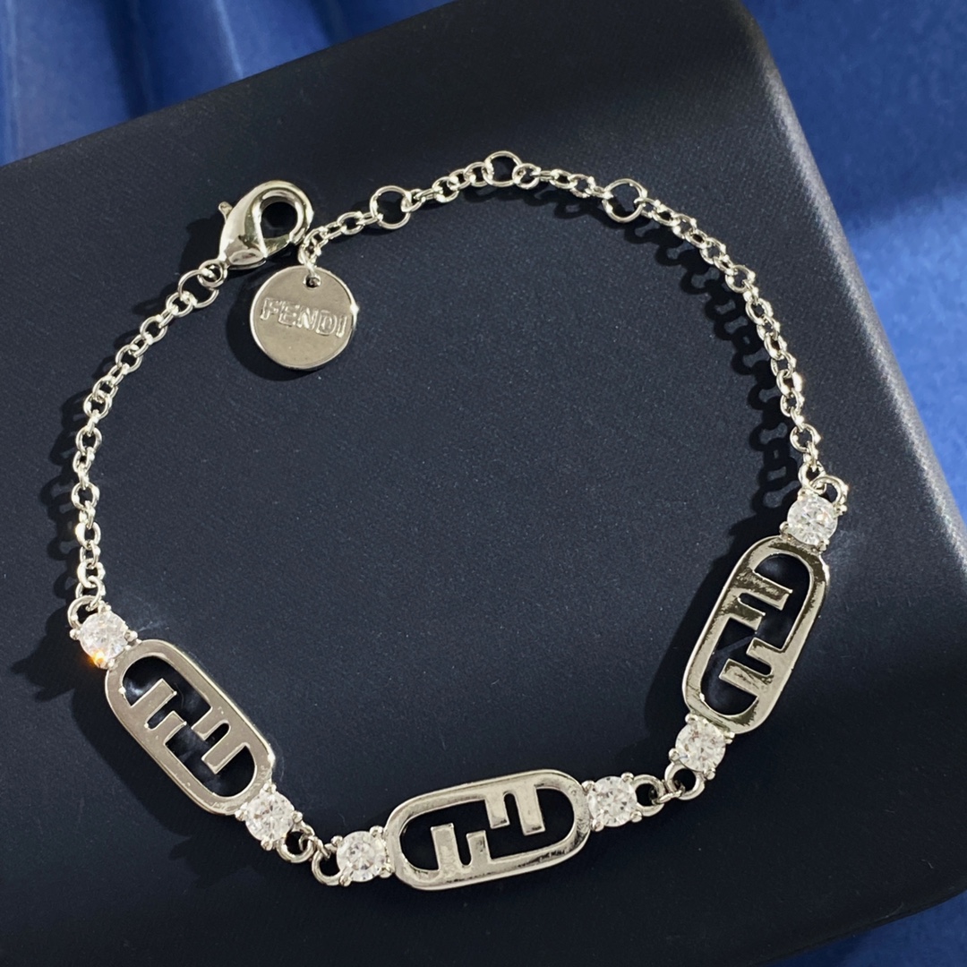 Fendi O Lock bracelet Gold-tone metal with clear faceted stones also available in silver-tone metal with clear faceted stones Adjustable with extension chain fits 16-19cm wrist
