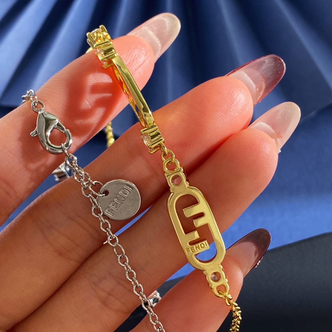 Fendi O Lock bracelet Gold-tone metal with clear faceted stones also available in silver-tone metal with clear faceted stones Adjustable with extension chain fits 16-19cm wrist
