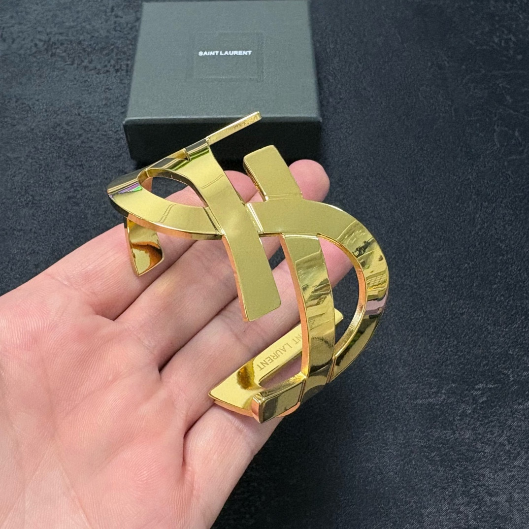Saint Laurent YSL Monogram Skeleton Cuff bracelet polished gold-tone metal polished silver-tone metal 6 5 inch inner circumference