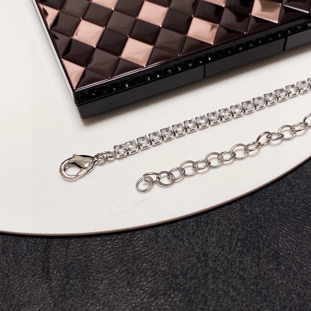 Saint Laurent Cassandre YSL Monogram Crystal Tennis Choker necklace silver-toned metal with clear faceted crystals gold-toned metal logo and bar accent 40cm with 5cm extender