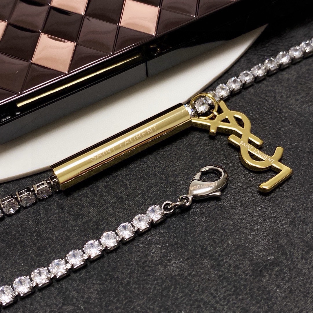 Saint Laurent Cassandre YSL Monogram Crystal Tennis Choker necklace silver-toned metal with clear faceted crystals gold-toned metal logo and bar accent 40cm with 5cm extender