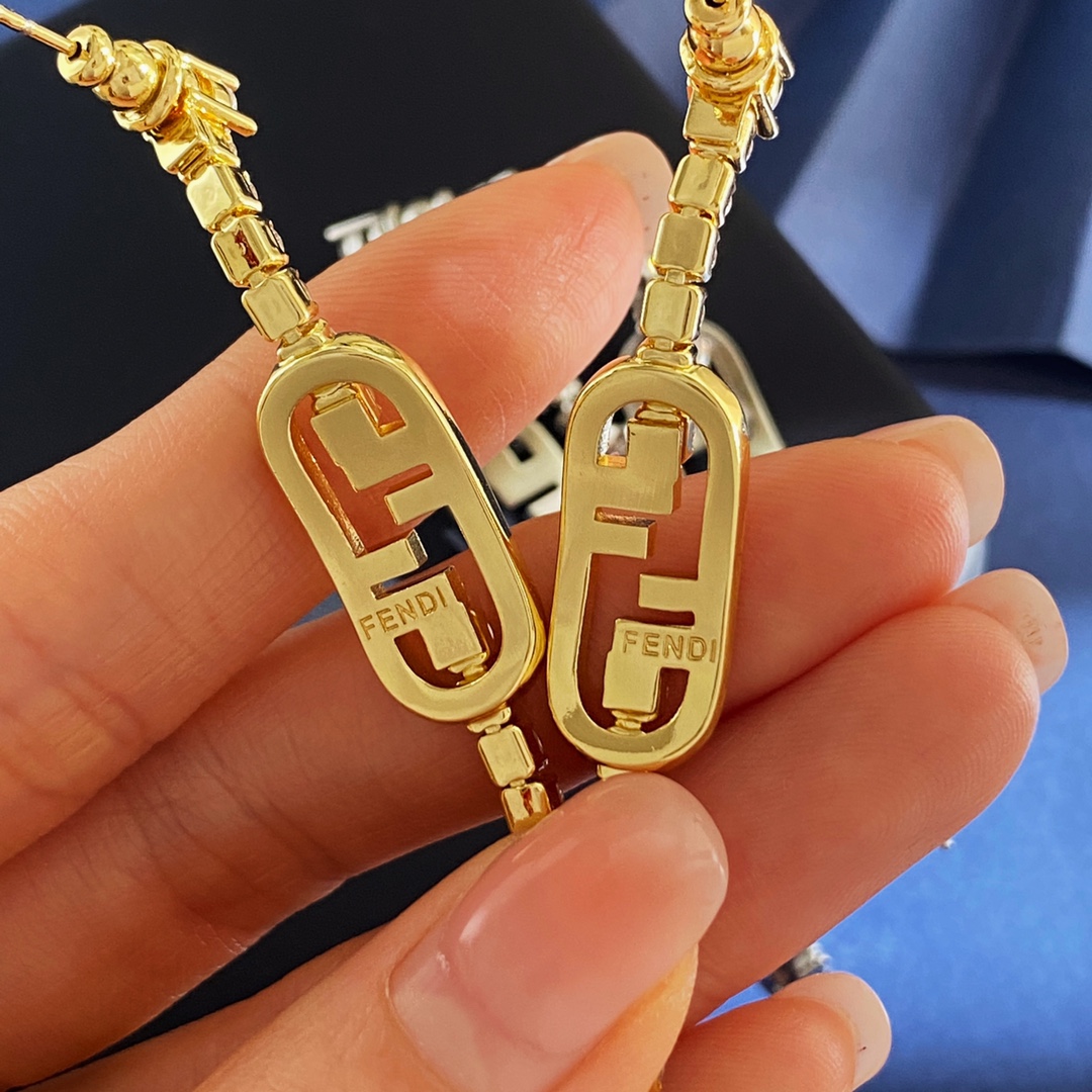 Fendi O Lock earrings gold-tone metal with clear crystal accents 58mm